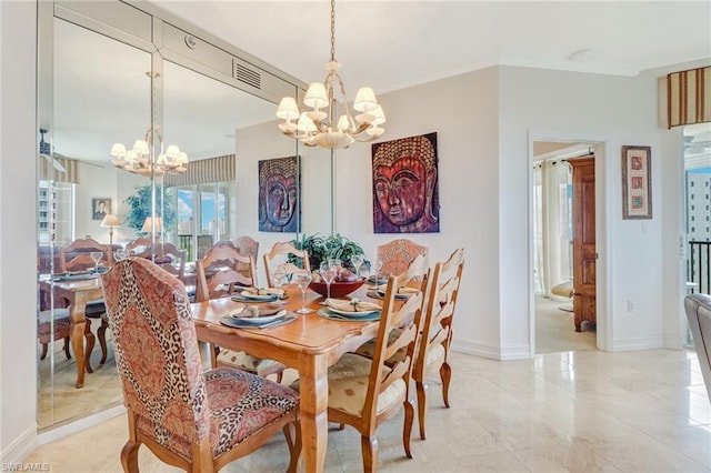 dining space featuring light tile floors and an inviting chandelier