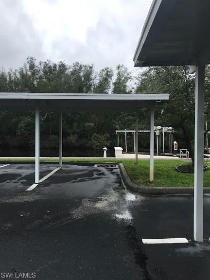 view of parking featuring a carport