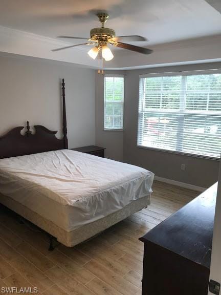 bedroom featuring hardwood / wood-style flooring and ceiling fan