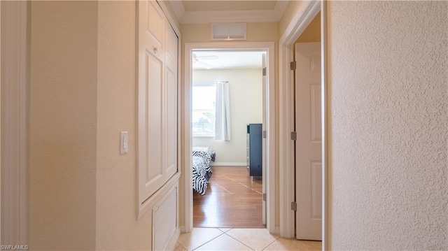 hall featuring light tile flooring