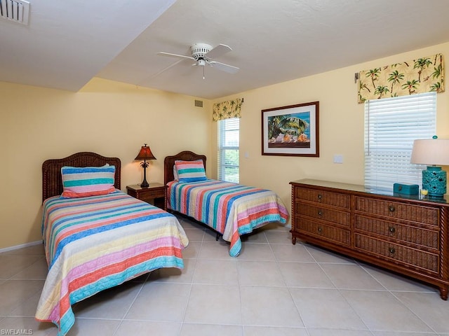 tiled bedroom with ceiling fan