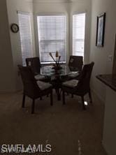 view of carpeted dining space