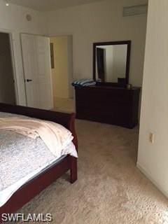 bedroom featuring light colored carpet