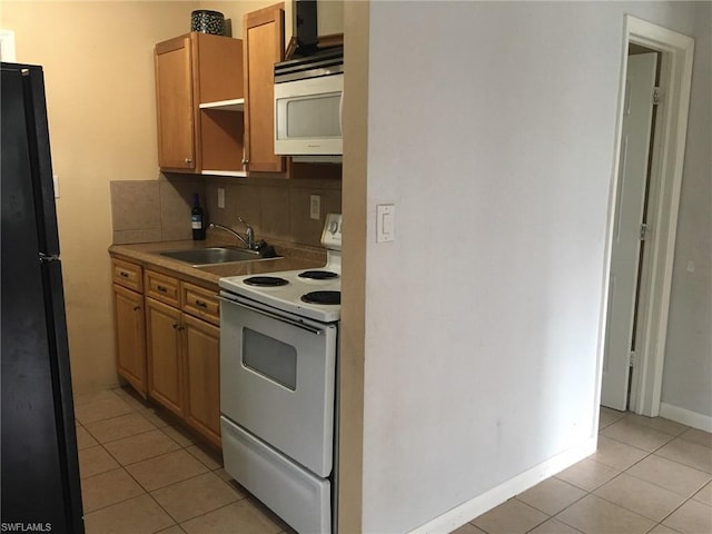 kitchen featuring tasteful backsplash, white appliances, sink, and light tile floors