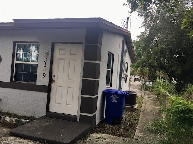 property entrance featuring central air condition unit