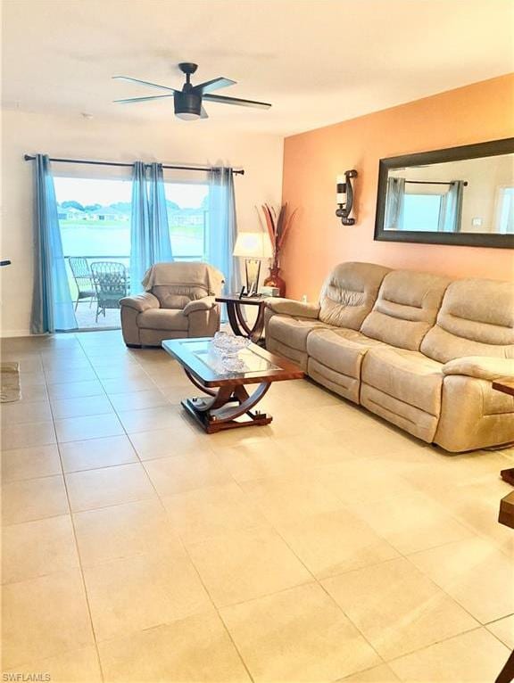 tiled living room featuring ceiling fan