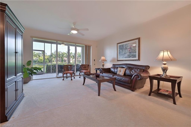 carpeted living room featuring ceiling fan