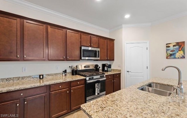 kitchen with light stone countertops, crown molding, sink, and stainless steel appliances