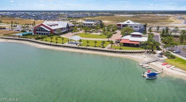 birds eye view of property with a beach view and a water view