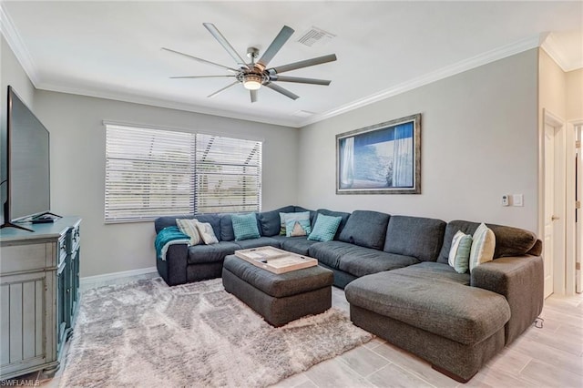 living room with ornamental molding and ceiling fan