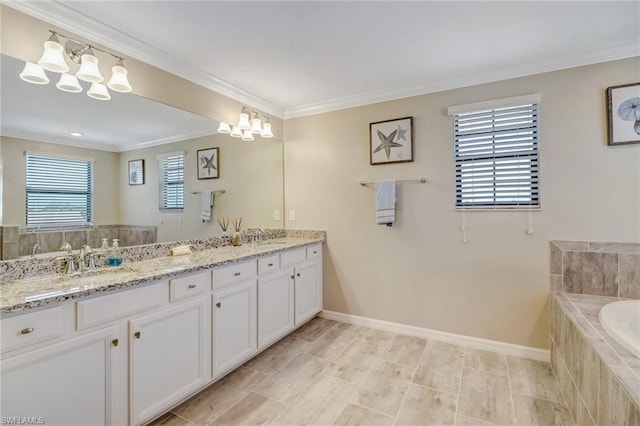 bathroom with a relaxing tiled bath, plenty of natural light, crown molding, and double sink vanity