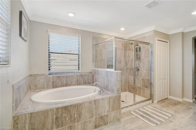 bathroom with shower with separate bathtub, ornamental molding, and tile floors