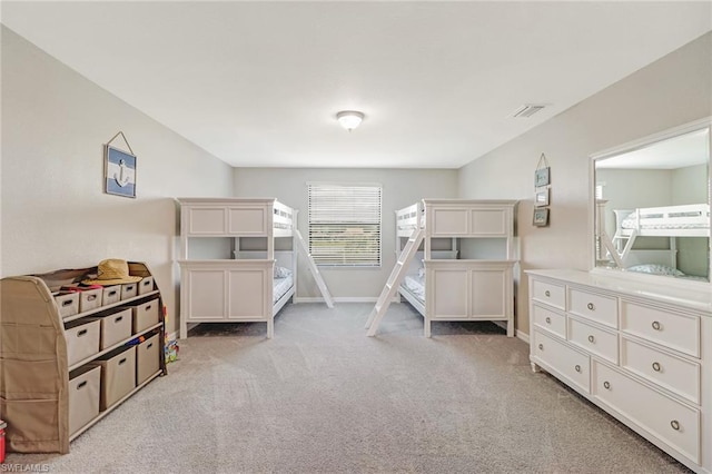 bedroom featuring light carpet