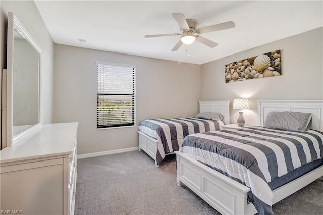 bedroom featuring dark carpet and ceiling fan