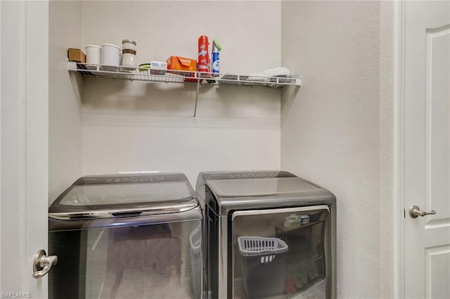 laundry room with washing machine and dryer