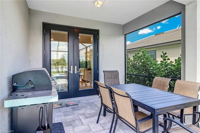 interior space featuring french doors and light tile floors