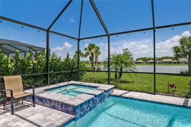 view of swimming pool with a patio, an in ground hot tub, a lanai, and a yard