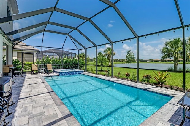 view of pool featuring an in ground hot tub, glass enclosure, and a patio area