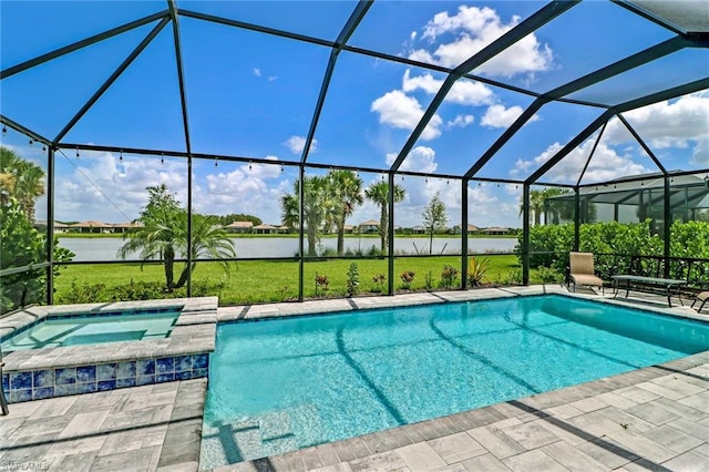 view of swimming pool featuring an in ground hot tub, a lanai, and a patio area