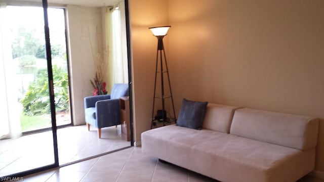 living room featuring a healthy amount of sunlight and light tile flooring