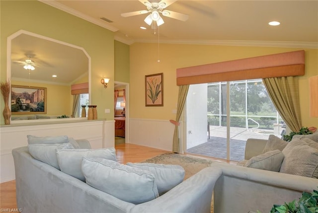 living room with plenty of natural light, ceiling fan, and light hardwood / wood-style flooring