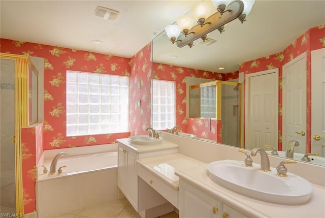 bathroom with tile floors, plus walk in shower, and dual vanity