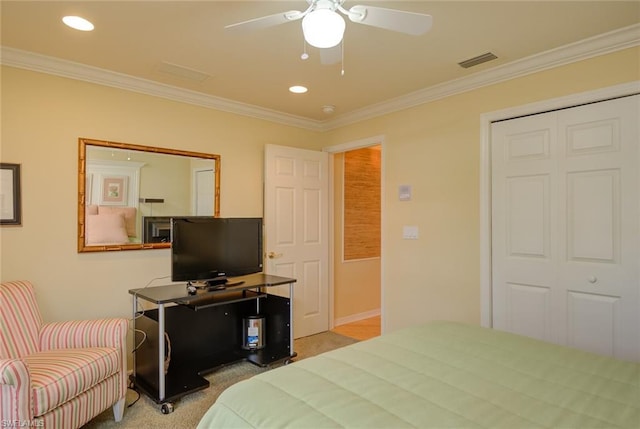 bedroom with crown molding, light colored carpet, and ceiling fan