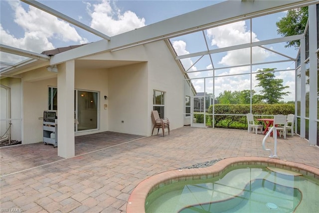 view of pool with a patio and a lanai