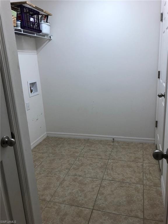 laundry room featuring light tile flooring and hookup for a washing machine