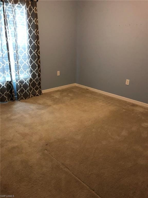 spare room featuring carpet flooring