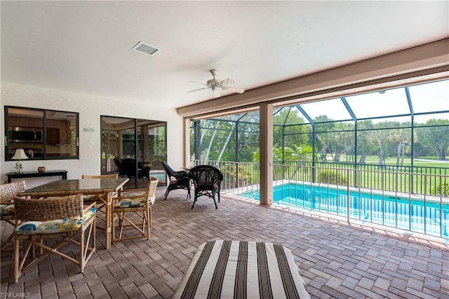 view of pool with ceiling fan