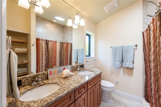 bathroom with double sink, a notable chandelier, tile floors, toilet, and oversized vanity