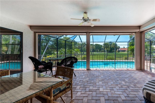 view of swimming pool with ceiling fan