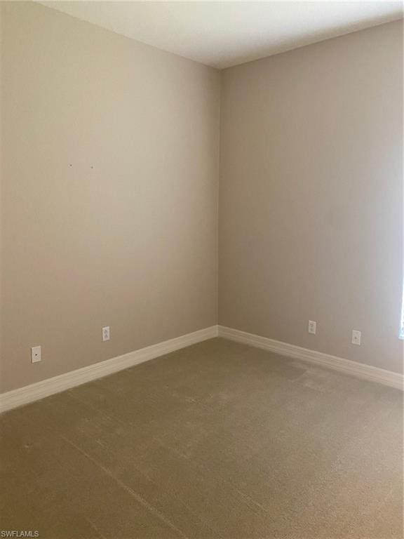 empty room featuring carpet flooring