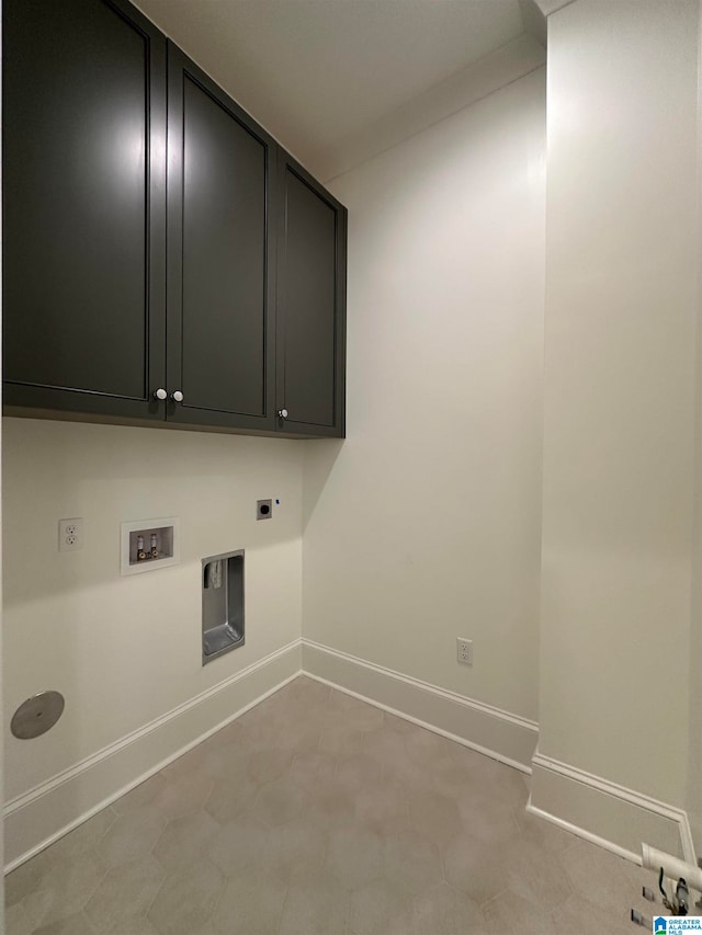 clothes washing area with cabinets, electric dryer hookup, and hookup for a washing machine