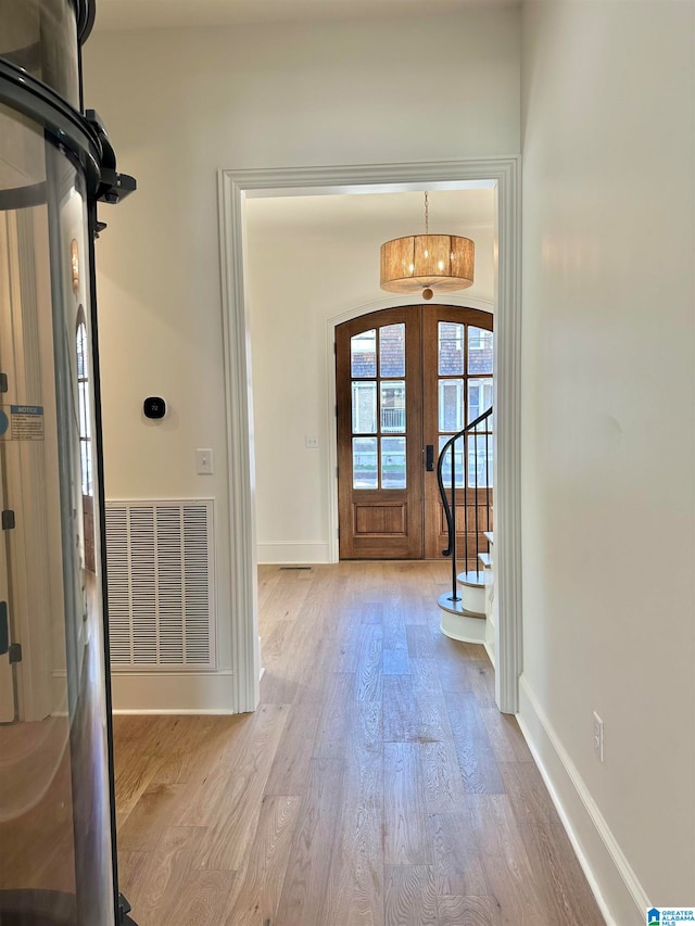 foyer with light hardwood / wood-style flooring