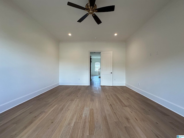 unfurnished room with ceiling fan and light hardwood / wood-style flooring