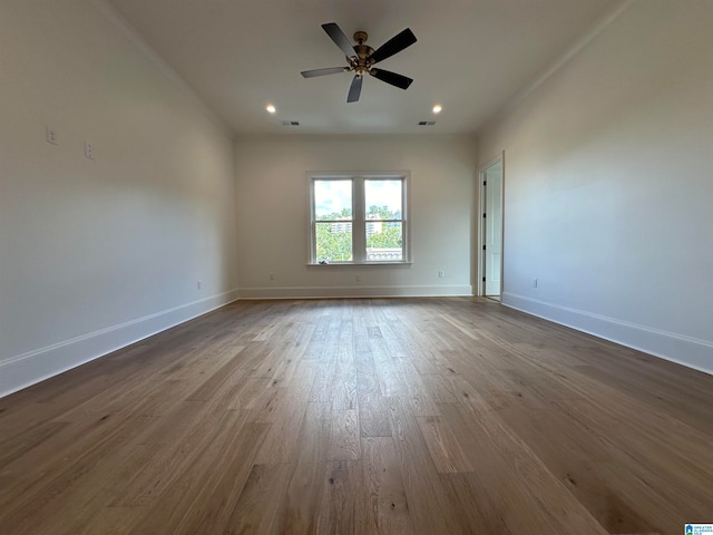 unfurnished room with wood-type flooring and ceiling fan