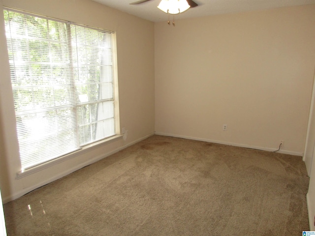 unfurnished room featuring carpet flooring and ceiling fan