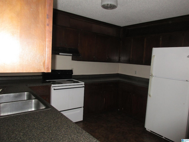 kitchen with sink, white appliances, dark brown cabinetry, and a textured ceiling