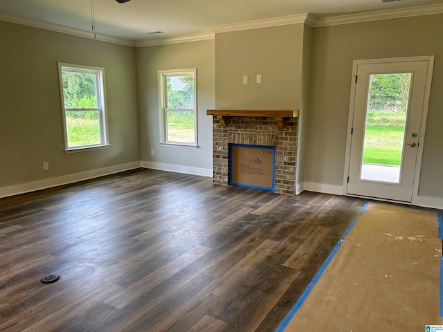 unfurnished living room featuring crown molding, a fireplace, and dark hardwood / wood-style floors