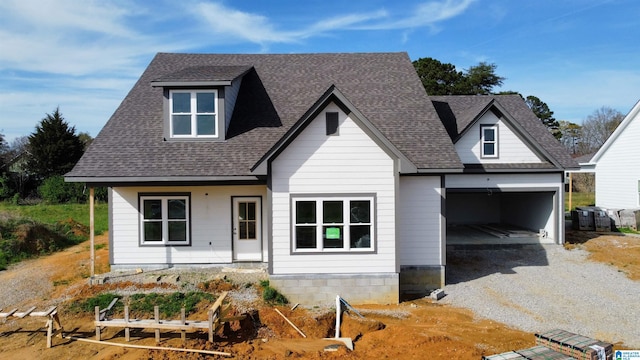 view of front facade featuring a garage and covered porch