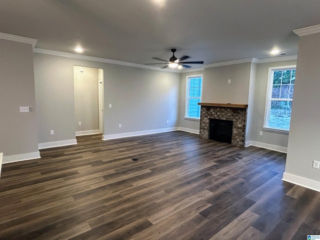 unfurnished living room featuring ceiling fan, crown molding, and dark wood-type flooring