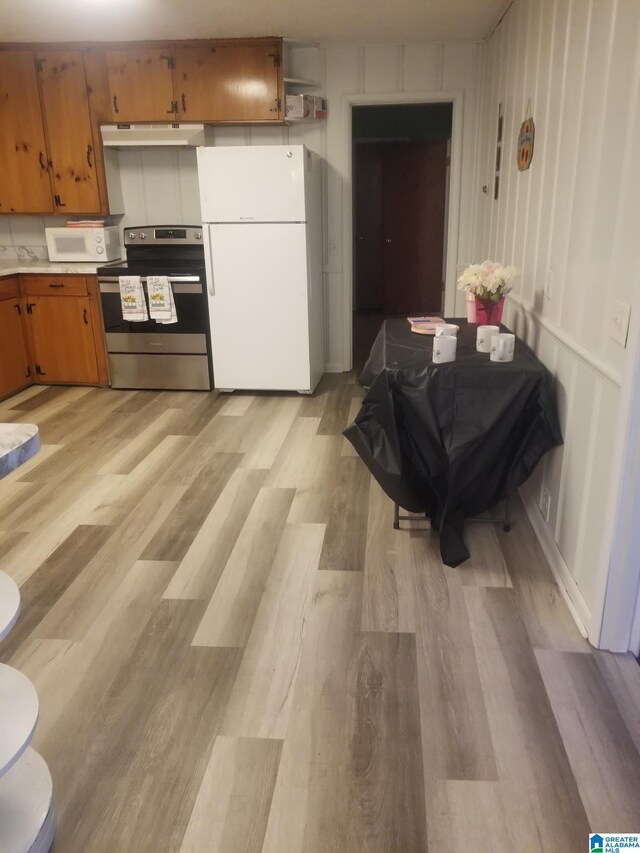 kitchen featuring white appliances and light wood-type flooring