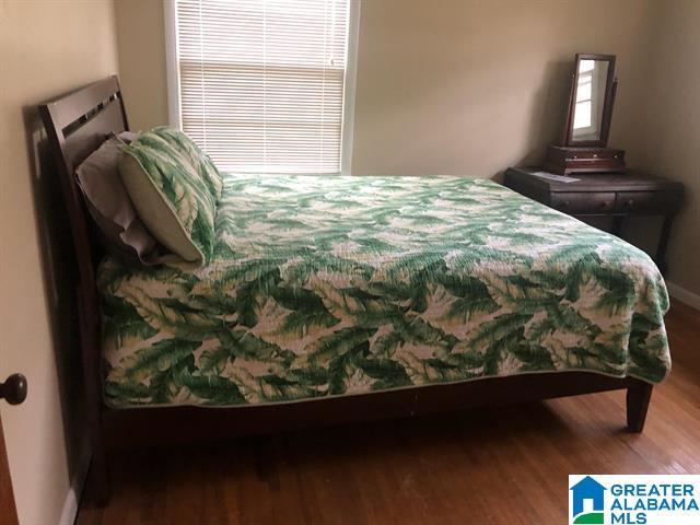 bedroom featuring dark wood-type flooring