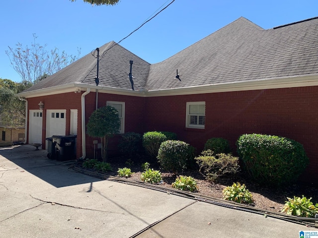 view of property exterior with a garage