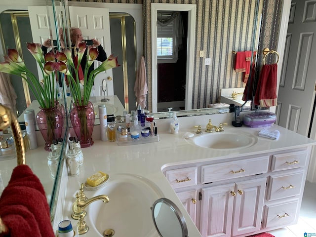 bathroom with tile flooring and vanity