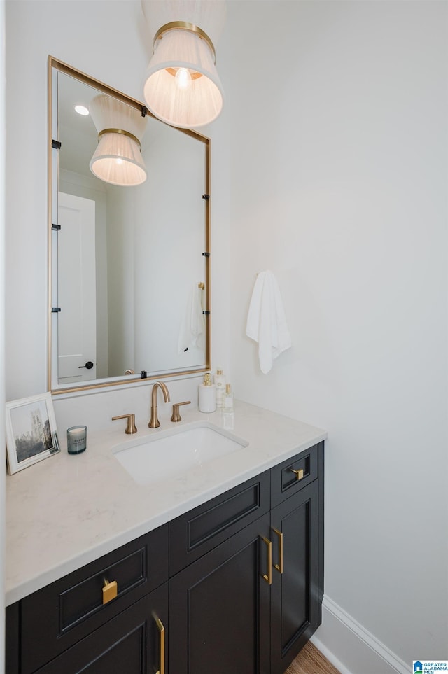 bathroom with vanity and wood-type flooring