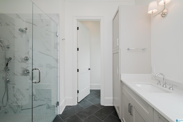 bathroom with tile patterned flooring, vanity, and walk in shower