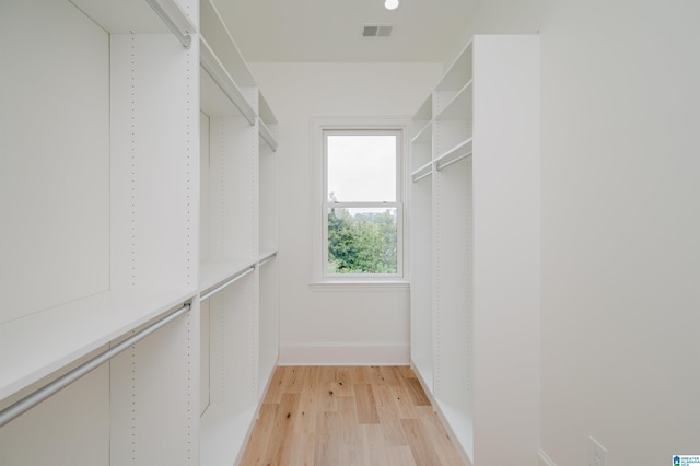 spacious closet featuring light wood-type flooring